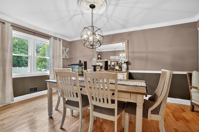 8 Argow Pl, Nanuet, NY 10954 - dining space featuring a chandelier, light wood finished floors, and crown molding