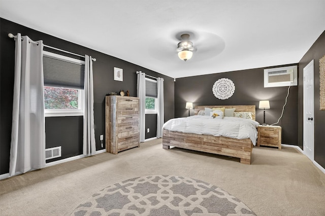 8 Argow Pl, Nanuet, NY 10954 - carpeted bedroom with a wall unit AC and ceiling fan