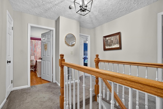 8 Argow Pl, Nanuet, NY 10954 - hall with an upstairs landing, carpet floors, and a chandelier