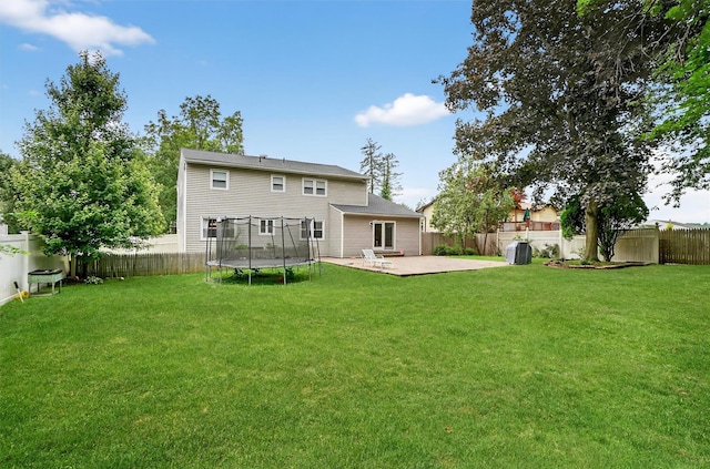 8 Argow Pl, Nanuet, NY 10954 - back of property featuring a trampoline, a patio area, and a fenced backyard