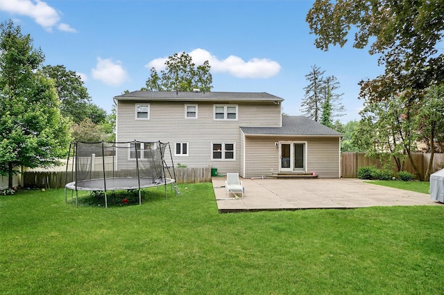 8 Argow Pl, Nanuet, NY 10954 - back of property featuring a trampoline, a patio area, and a fenced backyard