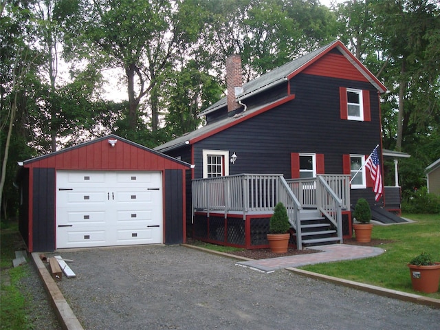 5 W Cottage Rd, Poughkeepsie, NY 12601 - chalet / cabin with a chimney, an outbuilding, a wooden deck, driveway, and a detached garage