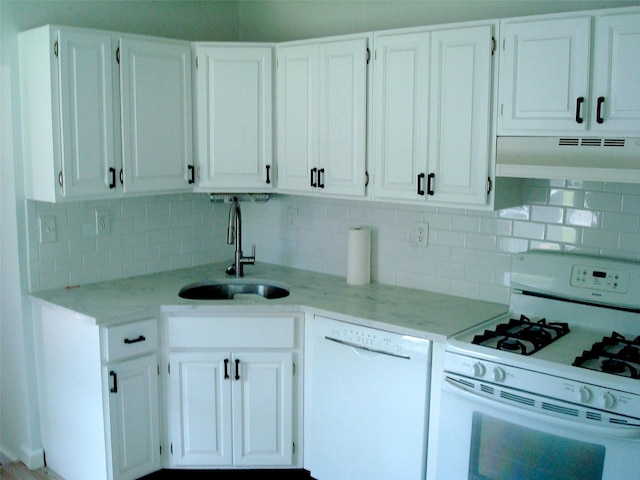 5 W Cottage Rd, Poughkeepsie, NY 12601 - kitchen with white appliances, backsplash, white cabinets, and light stone countertops