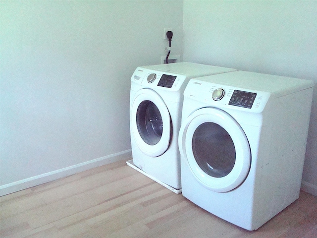 5 W Cottage Rd, Poughkeepsie, NY 12601 - laundry room with washer and dryer and wood finished floors