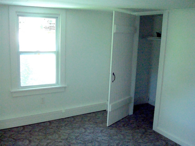 5 W Cottage Rd, Poughkeepsie, NY 12601 - unfurnished bedroom featuring a baseboard heating unit and carpet
