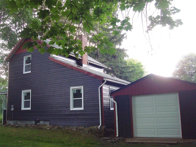 5 W Cottage Rd, Poughkeepsie, NY 12601 - view of side of property with a chimney, an outbuilding, and a detached garage