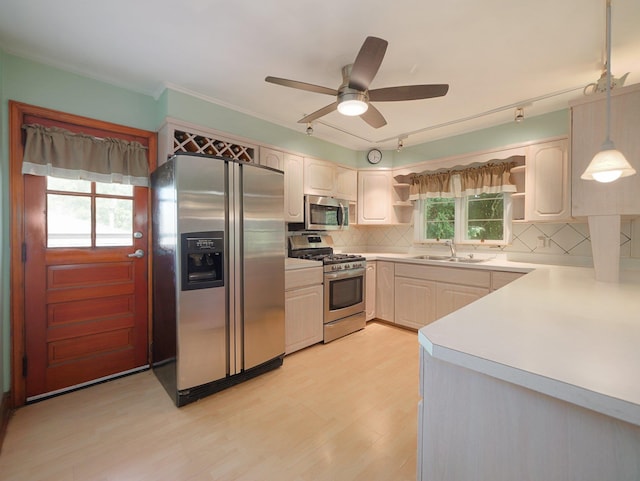 19 E Orchard St, Nanuet, NY 10954 - kitchen featuring stainless steel appliances, open shelves, light countertops, a ceiling fan, and decorative backsplash