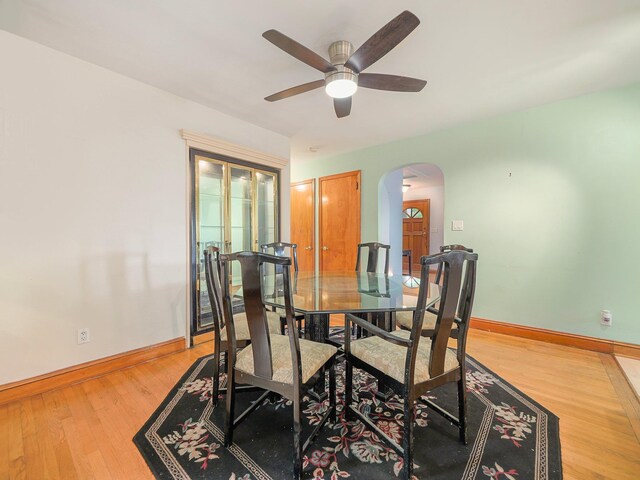 19 E Orchard St, Nanuet, NY 10954 - dining room with arched walkways, a ceiling fan, and light wood-type flooring