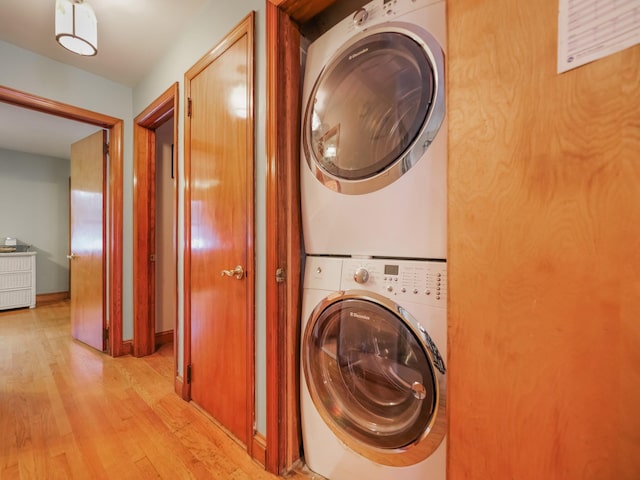 19 E Orchard St, Nanuet, NY 10954 - laundry area with estacked washer and dryer and light wood-style flooring