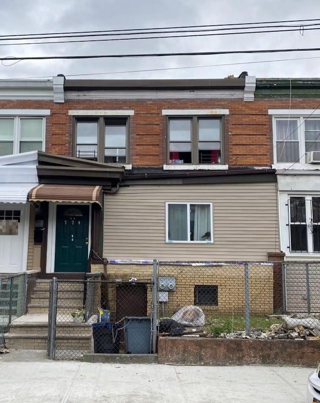 774 New Jersey, Brooklyn, NY 11207 - view of front facade with a fenced front yard and brick siding