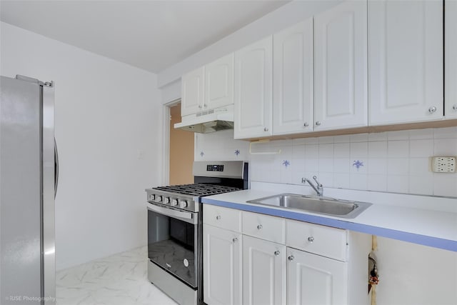 46-01 39th Ave Unit 303, Sunnyside, NY 11104 - kitchen with stainless steel appliances, under cabinet range hood, light marble finish floors, white cabinetry, and light countertops