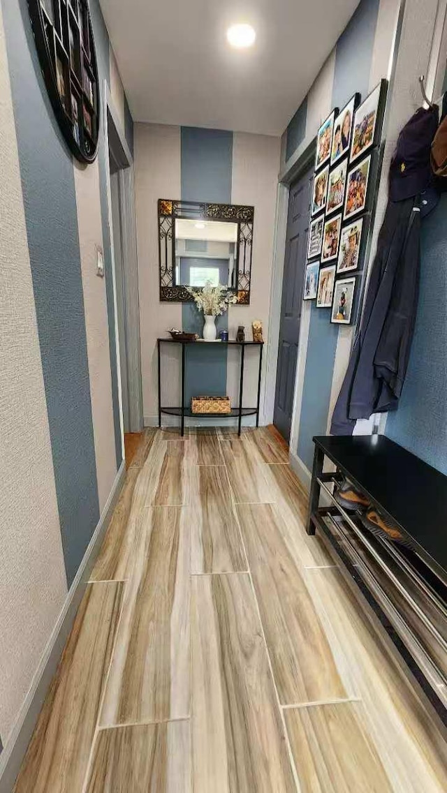 9-24 College Point Blvd, College Point, NY 11356 - hallway featuring wood finished floors and baseboards