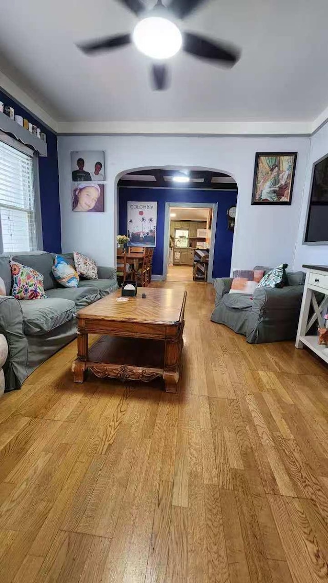 9-24 College Point Blvd, College Point, NY 11356 - living area with arched walkways, hardwood / wood-style floors, and a ceiling fan
