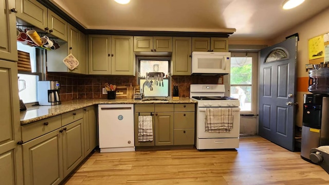9-24 College Point Blvd, College Point, NY 11356 - kitchen with white appliances, light wood-style floors, tasteful backsplash, and light stone countertops