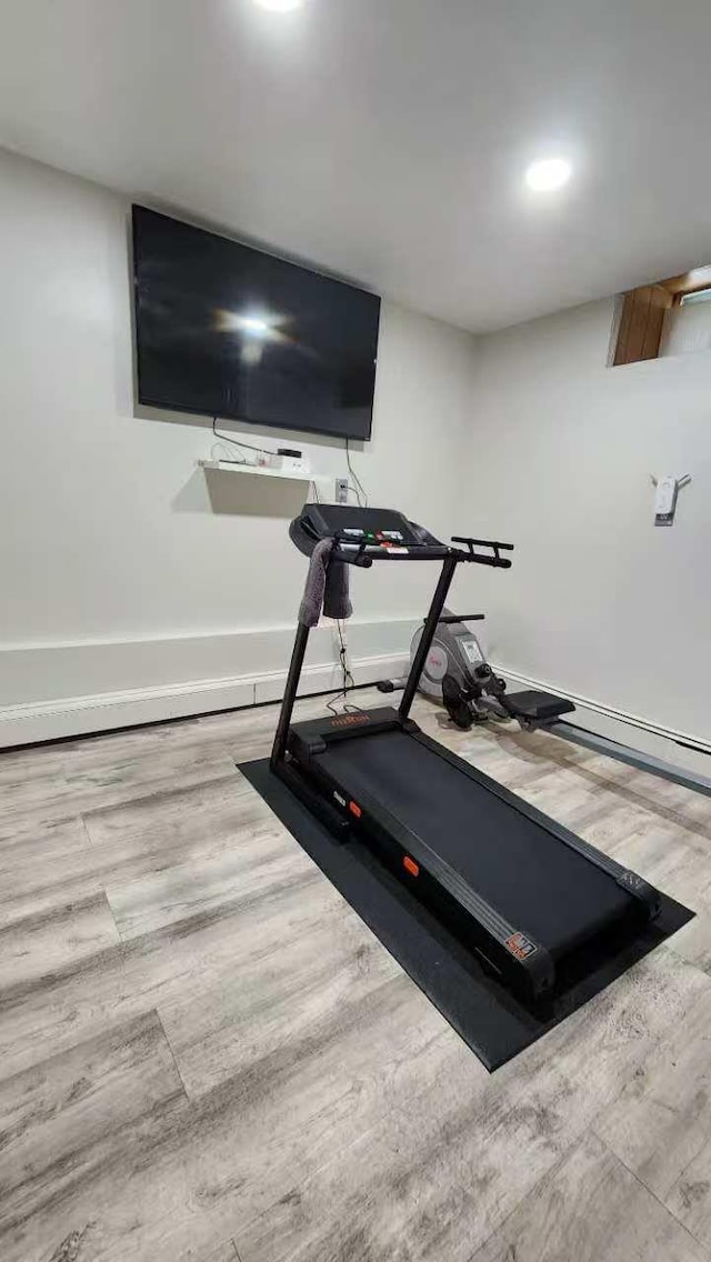 9-24 College Point Blvd, College Point, NY 11356 - exercise area featuring wood finished floors and baseboards