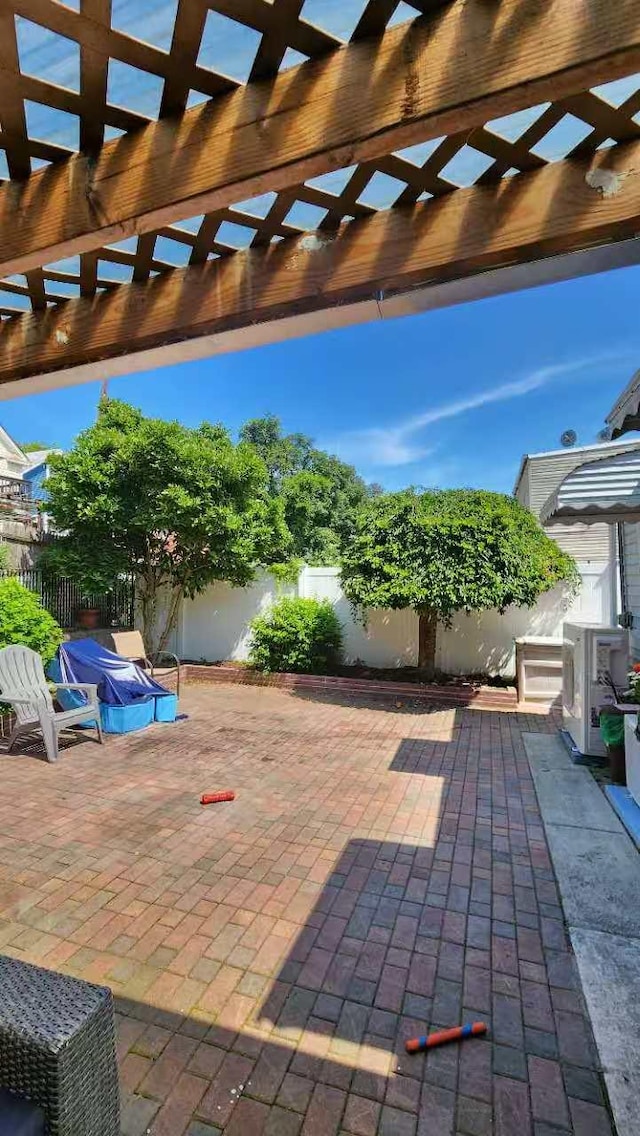 9-24 College Point Blvd, College Point, NY 11356 - fenced backyard with a patio and a pergola