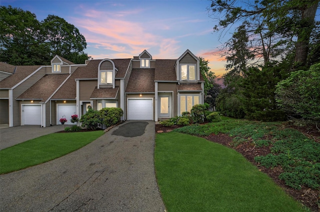32 Spring Pond Dr, Ossining, NY 10562 - view of front of home featuring a shingled roof, driveway, a front yard, and a garage