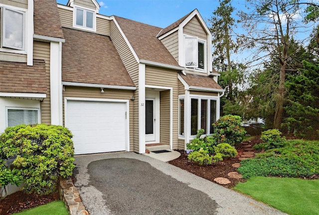 32 Spring Pond Dr, Ossining, NY 10562 - view of front of property with roof with shingles and driveway