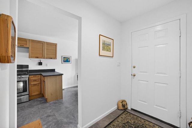 32 Spring Pond Dr, Ossining, NY 10562 - kitchen with stainless steel range oven, brown cabinetry, and dark countertops