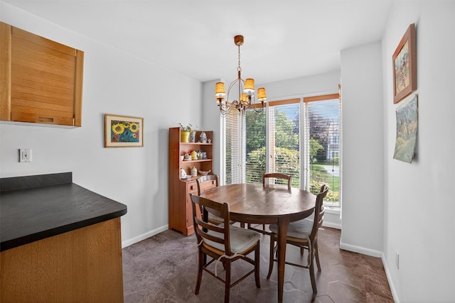 32 Spring Pond Dr, Ossining, NY 10562 - dining space featuring a chandelier and baseboards