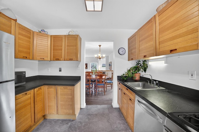32 Spring Pond Dr, Ossining, NY 10562 - kitchen featuring dishwasher, freestanding refrigerator, dark countertops, a chandelier, and range