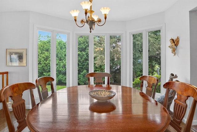 32 Spring Pond Dr, Ossining, NY 10562 - dining area featuring plenty of natural light and a chandelier
