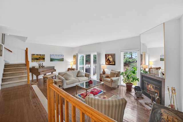 32 Spring Pond Dr, Ossining, NY 10562 - living room with hardwood / wood-style flooring, a glass covered fireplace, and stairs