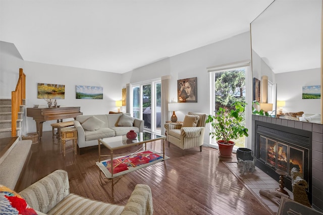 32 Spring Pond Dr, Ossining, NY 10562 - living area with stairway, a tile fireplace, plenty of natural light, and hardwood / wood-style flooring