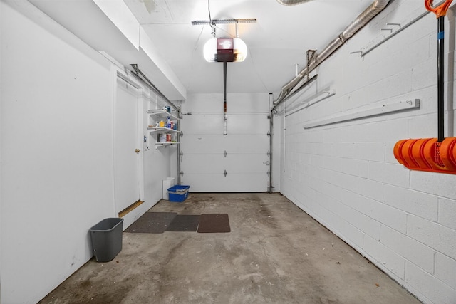 32 Spring Pond Dr, Ossining, NY 10562 - garage featuring a garage door opener