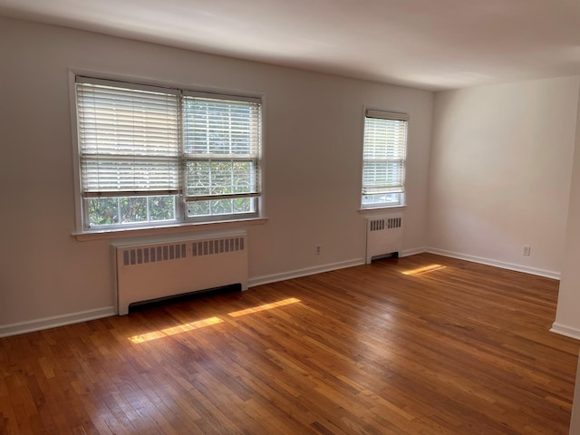 180 Pinewood Dr Unit 11, Hartsdale, NY 10530 - unfurnished room featuring radiator heating unit and wood-type flooring