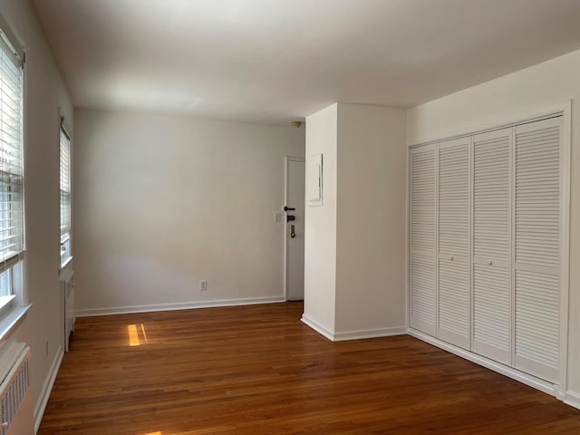 180 Pinewood Dr Unit 11, Hartsdale, NY 10530 - unfurnished bedroom featuring wood finished floors, radiator, and a closet