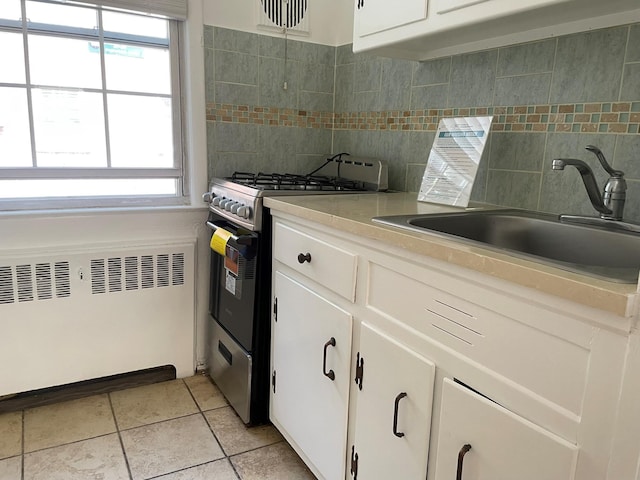 180 Pinewood Dr Unit 11, Hartsdale, NY 10530 - kitchen with stainless steel gas range oven, tasteful backsplash, light countertops, and white cabinets