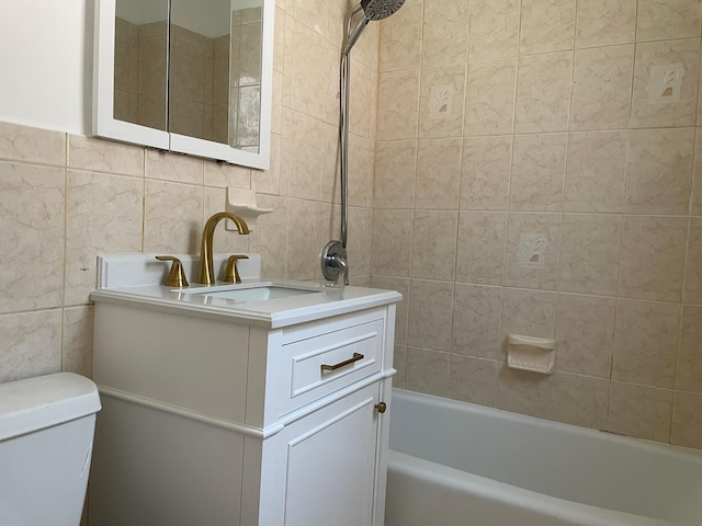 180 Pinewood Dr Unit 11, Hartsdale, NY 10530 - bathroom with tile walls, vanity, and shower / bathtub combination