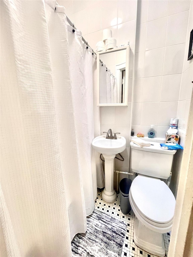 7863 79th Ln, Glendale, NY 11385 - full bath featuring tile walls and tile patterned flooring