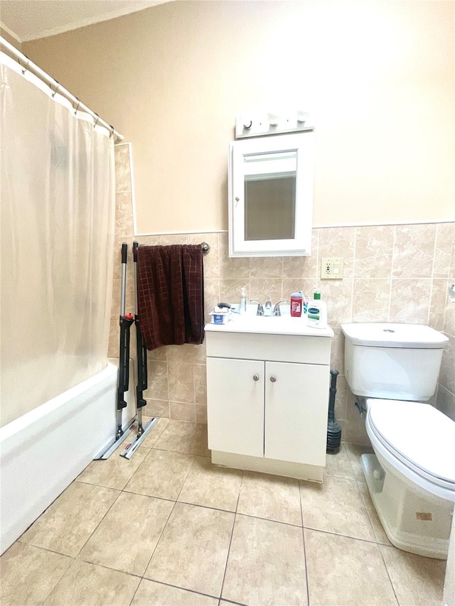 7863 79th Ln, Glendale, NY 11385 - full bath with vanity, tile patterned flooring, tile walls, shower / bath combo, and wainscoting