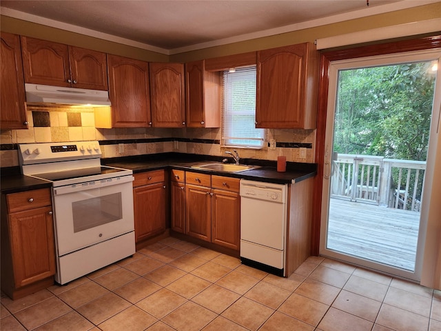 26 Long Beach Dr, Sound Beach, NY 11789 - kitchen featuring white appliances, under cabinet range hood, and dark countertops