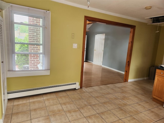 26 Long Beach Dr, Sound Beach, NY 11789 - empty room with a baseboard radiator, light tile patterned flooring, and a smoke detector