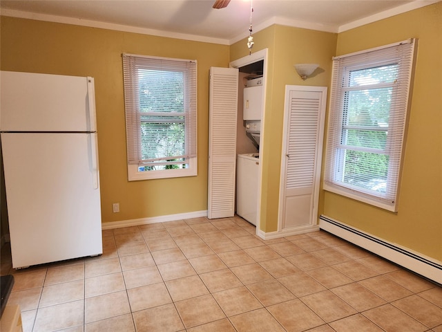 26 Long Beach Dr, Sound Beach, NY 11789 - kitchen featuring freestanding refrigerator, stacked washer / drying machine, baseboard heating, crown molding, and a ceiling fan