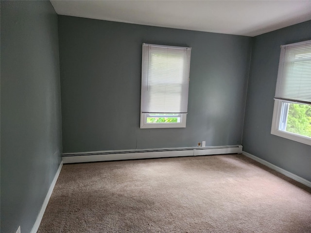 26 Long Beach Dr, Sound Beach, NY 11789 - carpeted empty room featuring a baseboard heating unit and baseboards