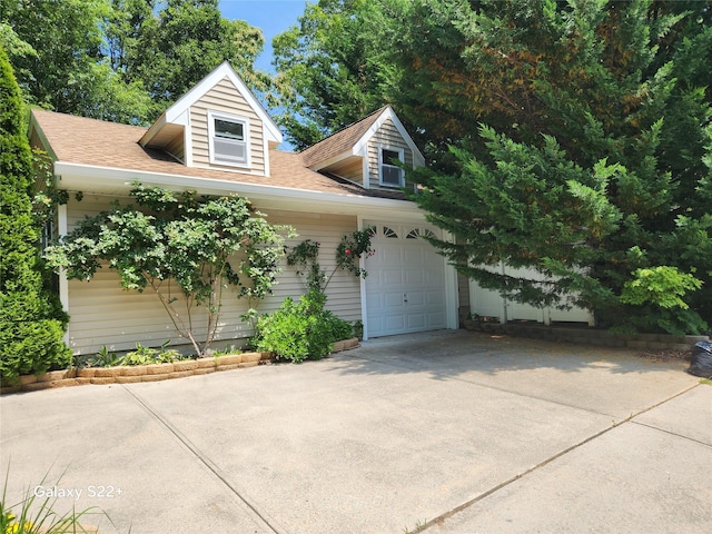 26 Long Beach Dr, Sound Beach, NY 11789 - view of front facade with driveway, a garage, and a shingled roof