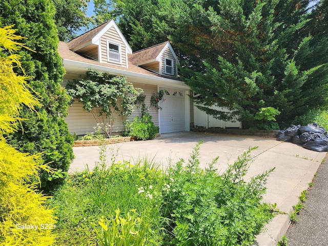 26 Long Beach Dr, Sound Beach, NY 11789 - view of front facade with driveway and roof with shingles