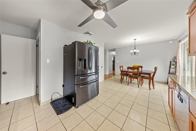 162 Airport Rd, New Hampton, NY 10958 - kitchen with stainless steel fridge, dishwasher, light tile patterned floors, a chandelier, and ceiling fan