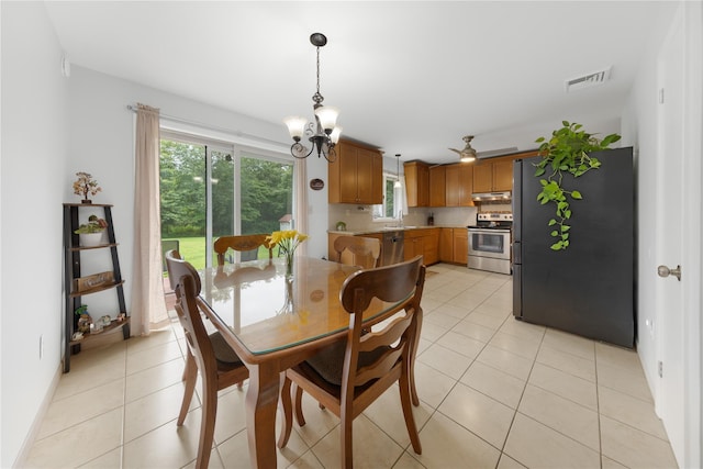 162 Airport Rd, New Hampton, NY 10958 - dining area featuring a chandelier, light tile patterned floors, and a ceiling fan