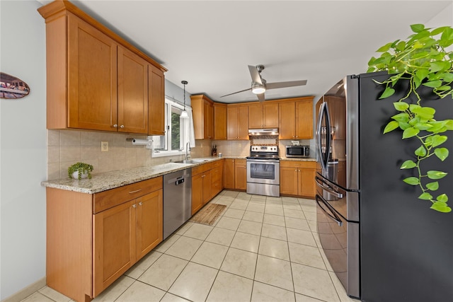 162 Airport Rd, New Hampton, NY 10958 - kitchen with stainless steel appliances, backsplash, ceiling fan, under cabinet range hood, and light stone counters