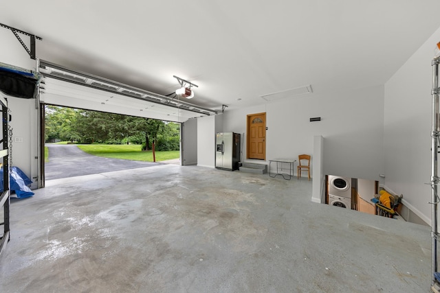 162 Airport Rd, New Hampton, NY 10958 - garage with stainless steel fridge with ice dispenser and a garage door opener