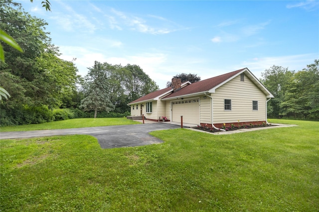 162 Airport Rd, New Hampton, NY 10958 - rear view of house with driveway, a chimney, a lawn, and a garage