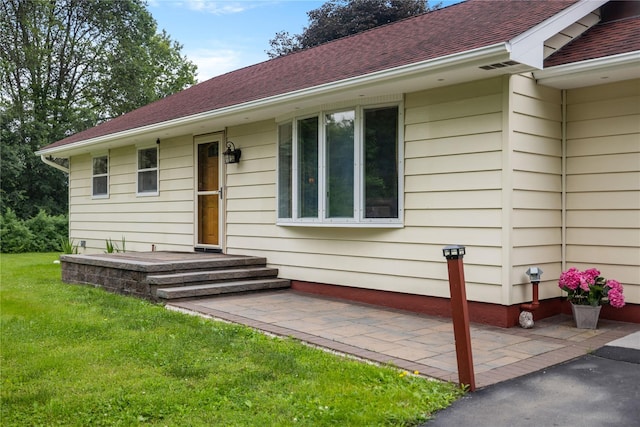 162 Airport Rd, New Hampton, NY 10958 - entrance to property featuring a yard, a shingled roof, and a patio area
