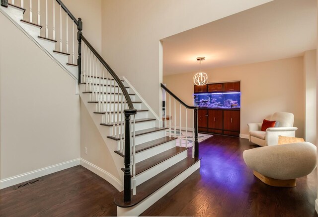 45 Jeffrey Dr, Pleasant Valley, NY 12569 - stairs with wood finished floors and a chandelier
