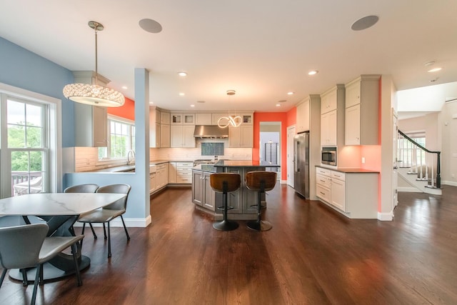 45 Jeffrey Dr, Pleasant Valley, NY 12569 - kitchen featuring under cabinet range hood, appliances with stainless steel finishes, dark wood-style flooring, recessed lighting, and tasteful backsplash