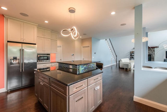 45 Jeffrey Dr, Pleasant Valley, NY 12569 - kitchen featuring appliances with stainless steel finishes, a center island, dark wood-type flooring, decorative light fixtures, and recessed lighting